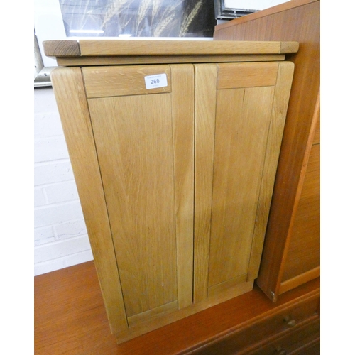 269 - A modern heavy light oak two door cd cabinet