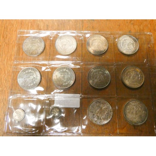 261 - A collection of ten US dollar coins and two others