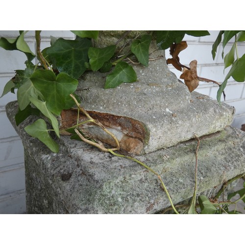 453 - A pair of large reconstituted stone garden shaped planters on square plinth bases (both as found)