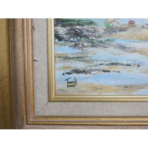 28 - A gilt framed oil painting of children rock pooling on the beach. Signed Ivan H, 2002