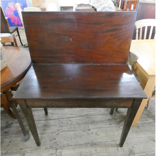 71 - A Victorian mahogany folding top tea table on square taper legs. 3' wide