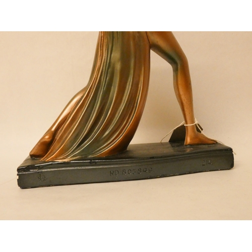 200 - An Art Deco bronze effect plaster model of a dancing lady. Registration number on reverse