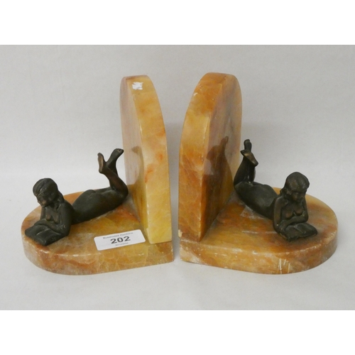 202 - A pair of Art Deco alabaster and female form mounted bookends