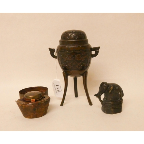 211 - A Japanese bronze incense burner on tripod stand, an elephant shaped opium weight and a hat box shap... 