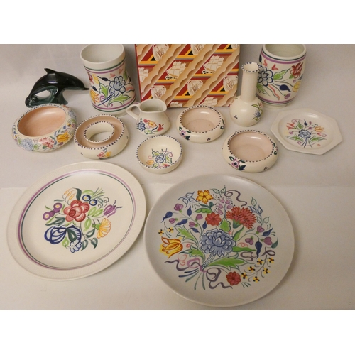 220 - A large collection of traditional floral decorated Poole Pottery and a copy of the Poole Pottery ref... 