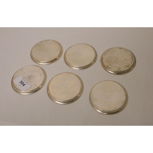 504 - A set of six white metal coasters with engraved decoration, marked 84 to base and foreign hallmarks.... 