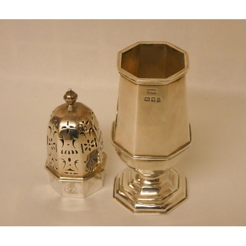 511 - A Mappin & Webb octagonal bodied, hallmarked silver sugar shaker. 20cm tall. Hallmarked London 1918.... 