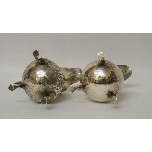 516 - Two Georgian silver cream jugs, one with embossed decoration. Gross weight 4.7 troy ozs.