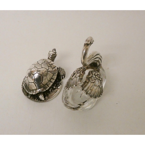 533 - A hallmarked silver covered model of a tortoise and a silver mounted articulated Swan salt cellar.