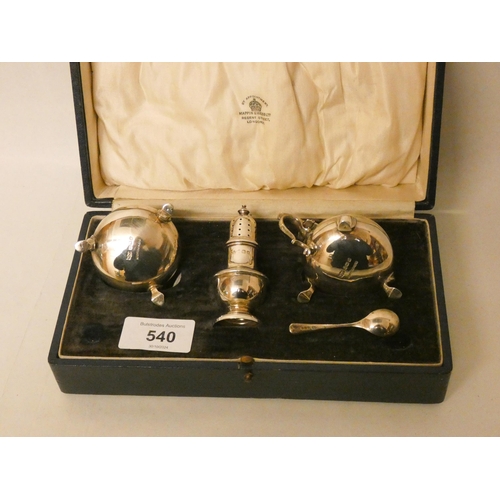 540 - A cased Mappin & Webb three piece silver cruet set.