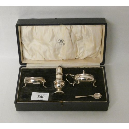 540 - A cased Mappin & Webb three piece silver cruet set.