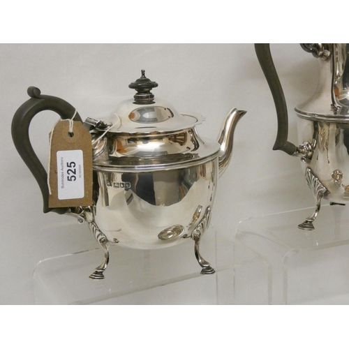 525 - A four piece silver tea service, with ebony handles and standing on hoof feet, two pieces hallmarked... 