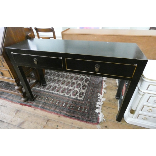 89 - A black ebonised Chinese style hall table fitted two drawers. 4' wide