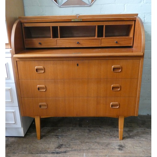 126 - A modern teak cylinder top bureau with three drawers under. 3' wide