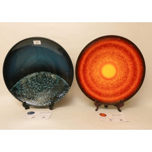 237 - Two large charger plates, Poole - The Sun and Moon collection designed by Alan Clark. Both with cert... 