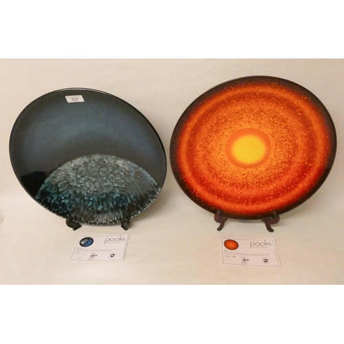 237 - Two large charger plates, Poole - The Sun and Moon collection designed by Alan Clark. Both with cert... 