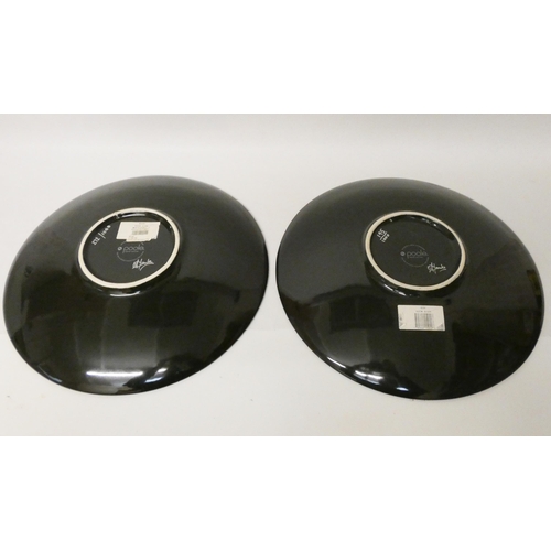 237 - Two large charger plates, Poole - The Sun and Moon collection designed by Alan Clark. Both with cert... 