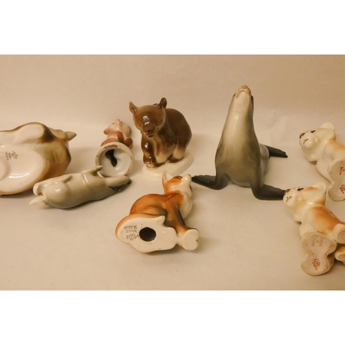 239 - A collection of ten Lomonosov USSR porcelain animal figurines to include a panda, a fox, a bear etc