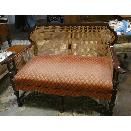 310 - A mahogany framed Bergere style two seater settee with upholstered seat