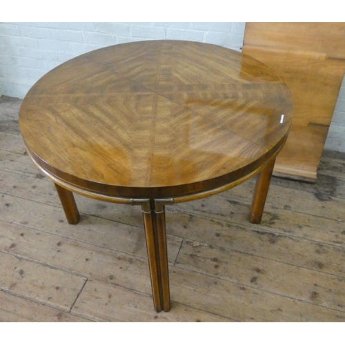 146 - A Waring & Gillow circular pecan wood extending dining table, opening to an oval, bought from Waring... 