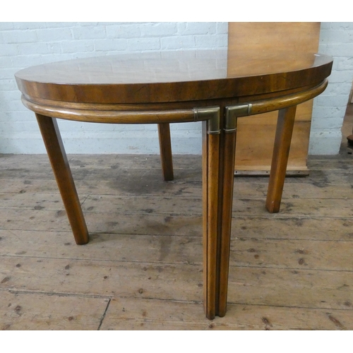 146 - A Waring & Gillow circular pecan wood extending dining table, opening to an oval, bought from Waring... 