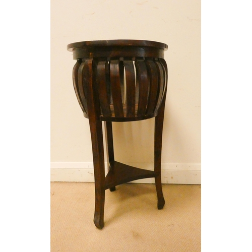 160 - A circular mahogany plant stand with under tier. 15.5