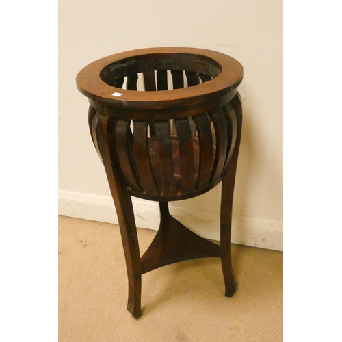 160 - A circular mahogany plant stand with under tier. 15.5