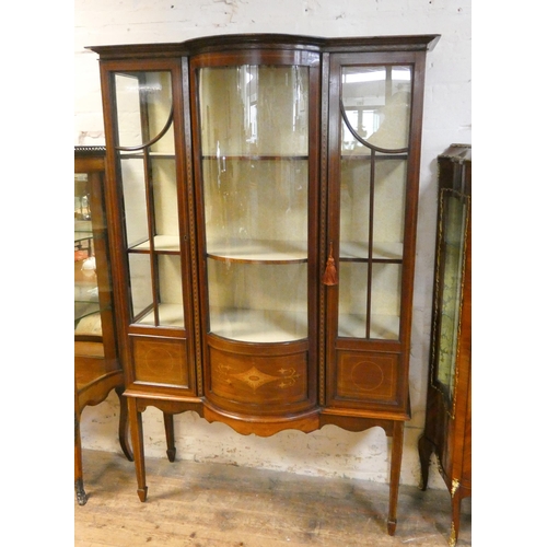 164 - An Edwardian inlaid mahogany china display cabinet with bow centre section standing on square taper ... 