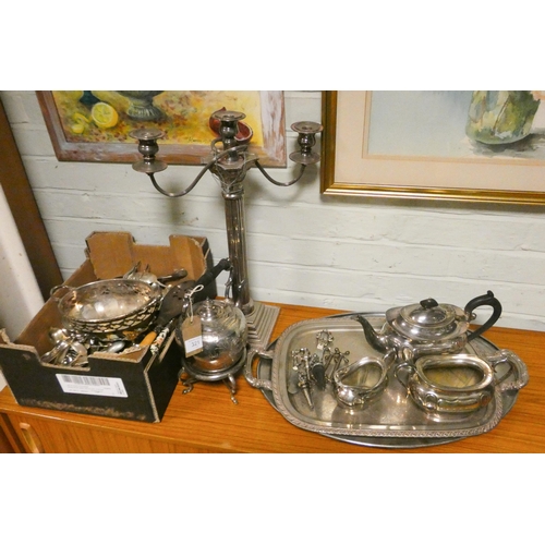 321 - A large quantity of silver plated wares, trays - tea set, spirit kettle, candelabra and cutlery