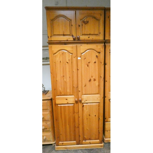 324 - A modern pine two door wardrobe with two long drawers under with detachable top box