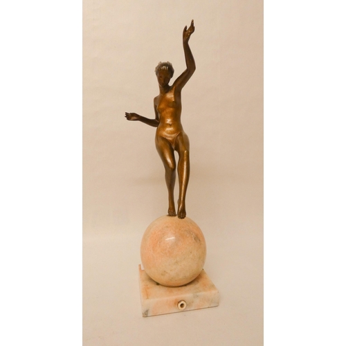 252 - Marcel-Andre Bouraine - An Art Deco French bronze figurine depicting a stylish dancer balancing atop... 