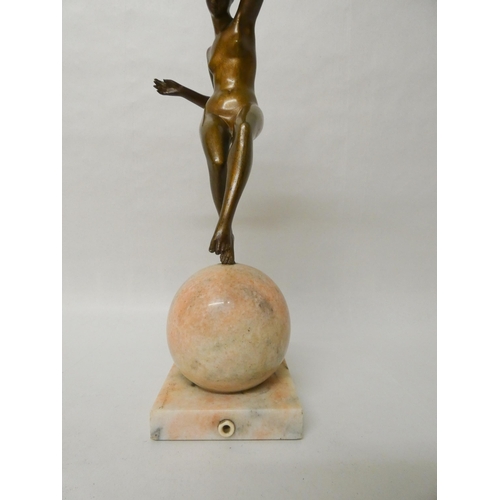 252 - Marcel-Andre Bouraine - An Art Deco French bronze figurine depicting a stylish dancer balancing atop... 