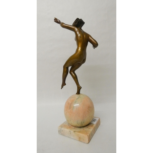 252 - Marcel-Andre Bouraine - An Art Deco French bronze figurine depicting a stylish dancer balancing atop... 