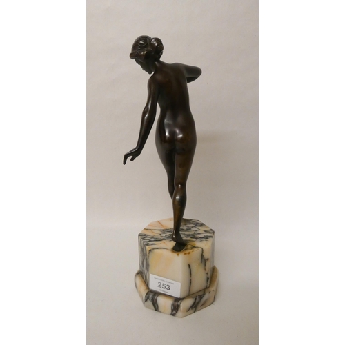 253 - Schumacher Foundry Austrian Art Deco bronze figure of a female nude, the octagonal marble base inset... 