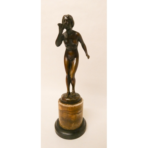 255 - Hans Rieder, (German, early 20th century). An Art Deco brown patinated bronze study of a nude female... 