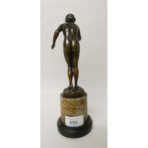 255 - Hans Rieder, (German, early 20th century). An Art Deco brown patinated bronze study of a nude female... 