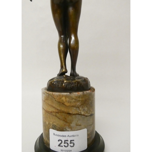 255 - Hans Rieder, (German, early 20th century). An Art Deco brown patinated bronze study of a nude female... 