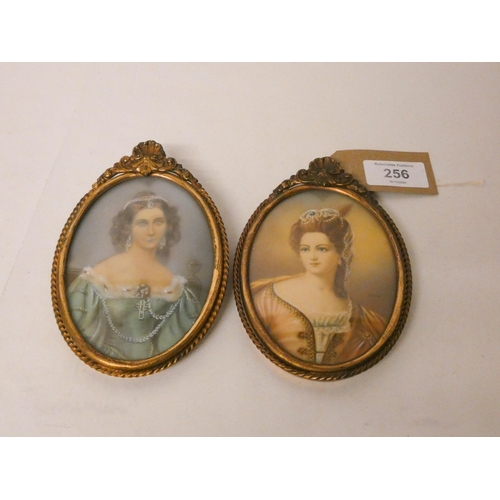 256 - Two Italian watercolour portrait miniatures of 18th century beauties. In oval shell mounted brass fr... 