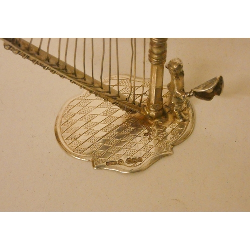 542 - An Edwardian silver novelty model of a harp. Hallmarked Sheffield 1900. 2.1 troy ozs. 10cm tall