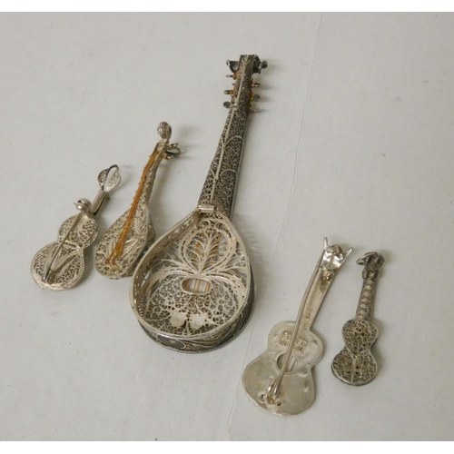 547 - A collection of five silver filigree models of stringed musical instruments. Largest measures 10cm l... 