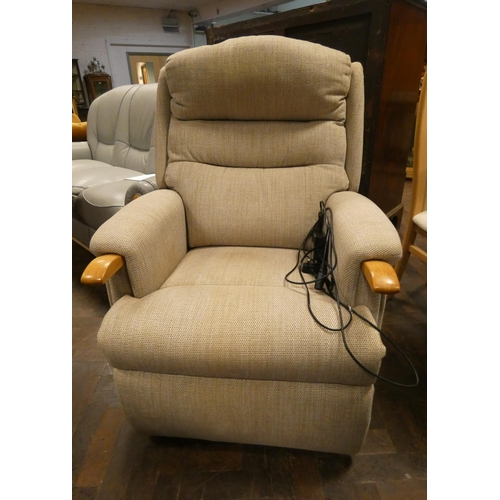 157 - A HSL electric rise and recline fawn  upholstered easy chair