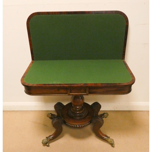 375 - A William IV mahogany fold over top card table on a pillar and platform base. Legs terminating in br... 