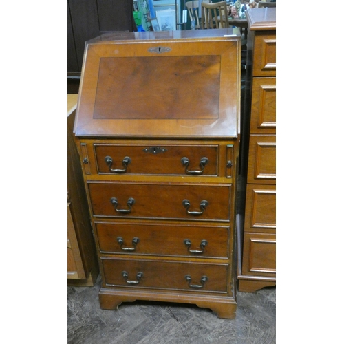 370 - A small yew wood ladies bureau fitted three long and one short drawer with interior fittings