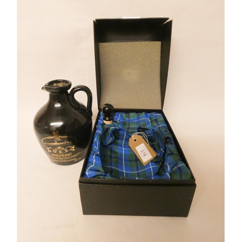 376 - A bottle of commemorative QE2 Highland Malt Scotch Whiskey by Morris and Bowmore. Still sealed with ... 