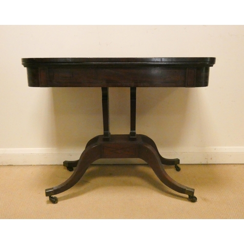 379 - A Victorian mahogany and line inlaid fold over top card table on a centre platform and pillar base