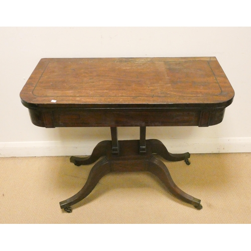 379 - A Victorian mahogany and line inlaid fold over top card table on a centre platform and pillar base