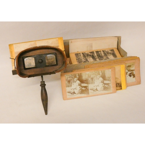 381 - A vintage stereoscope and a collection of stereoscopic cards