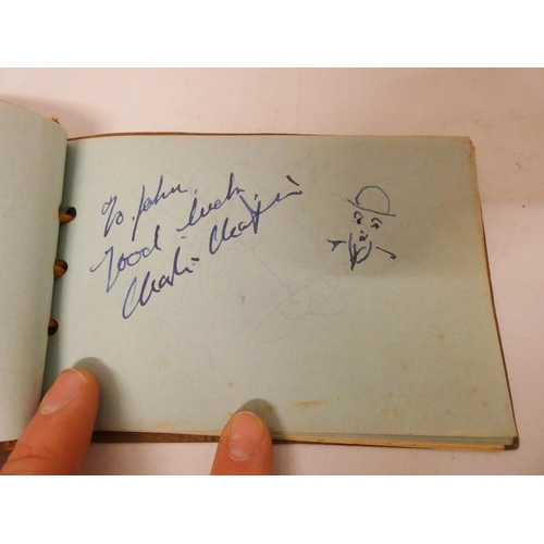 383 - An interesting autograph book containing autographs from Charlie Chaplin, Betty Grable, Edward G Rob... 