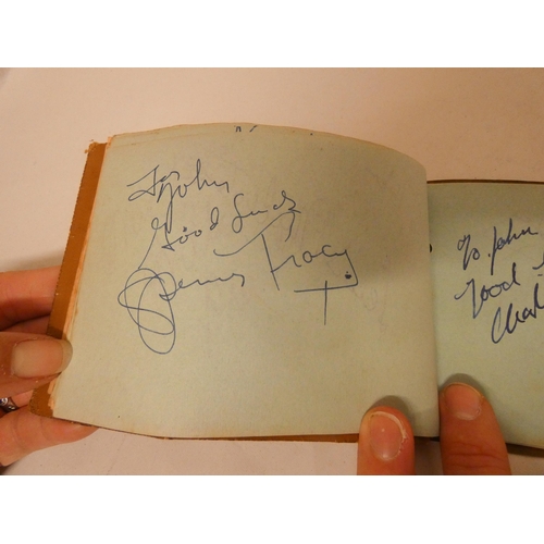 383 - An interesting autograph book containing autographs from Charlie Chaplin, Betty Grable, Edward G Rob... 