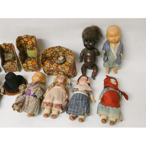 384 - A collection of vintage dolls and fabric covered dolls house furniture